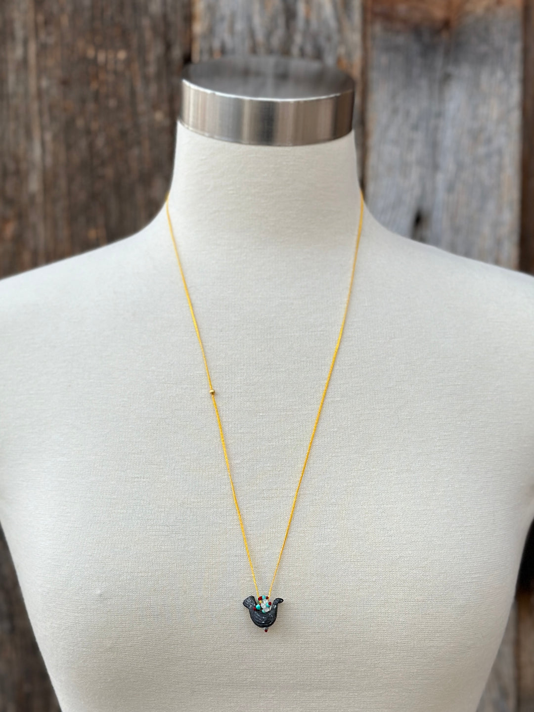 River Song Carved Stone Blackbird Necklace