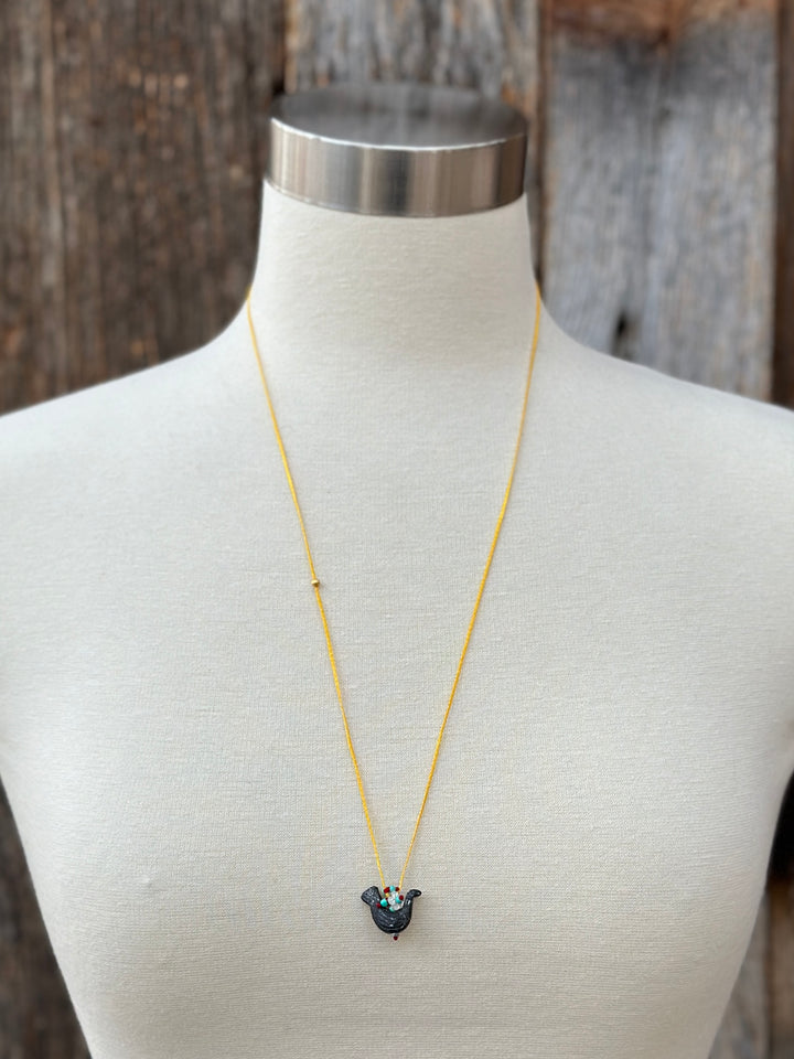 River Song Carved Stone Blackbird Necklace