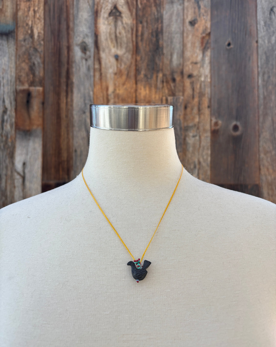 River Song Carved Stone Blackbird Necklace