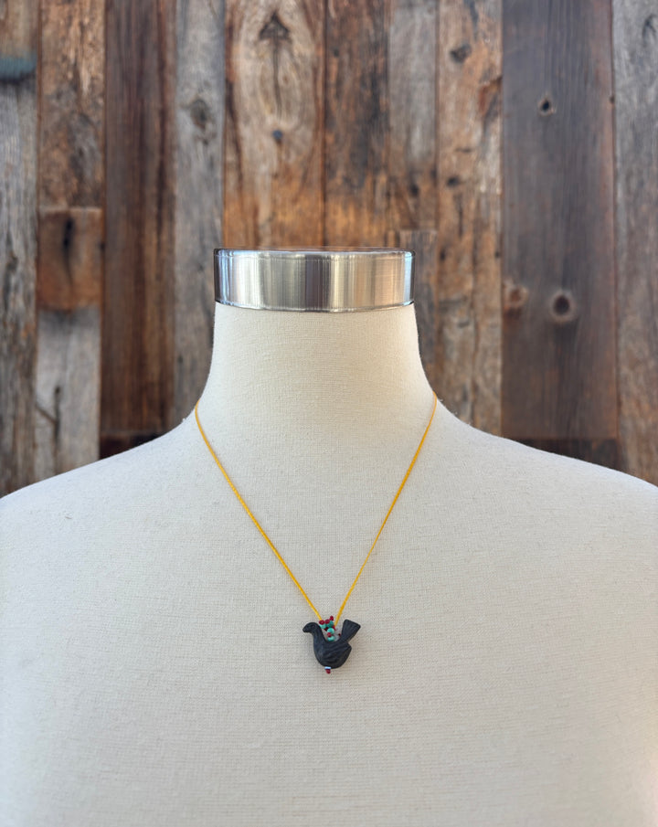 River Song Carved Stone Blackbird Necklace