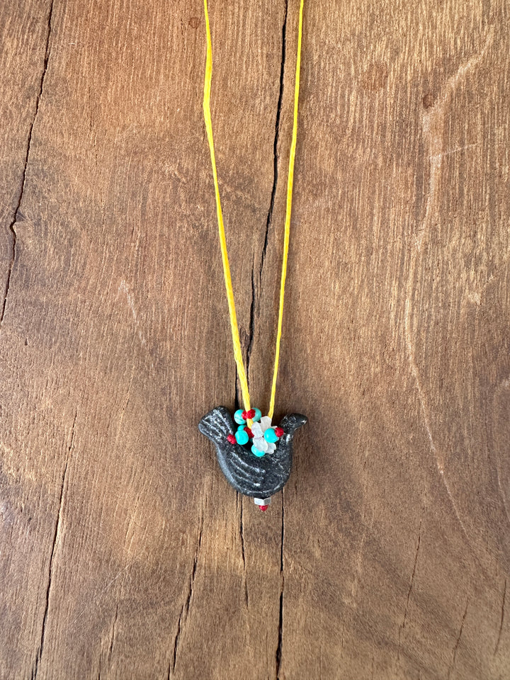 River Song Carved Stone Blackbird Necklace